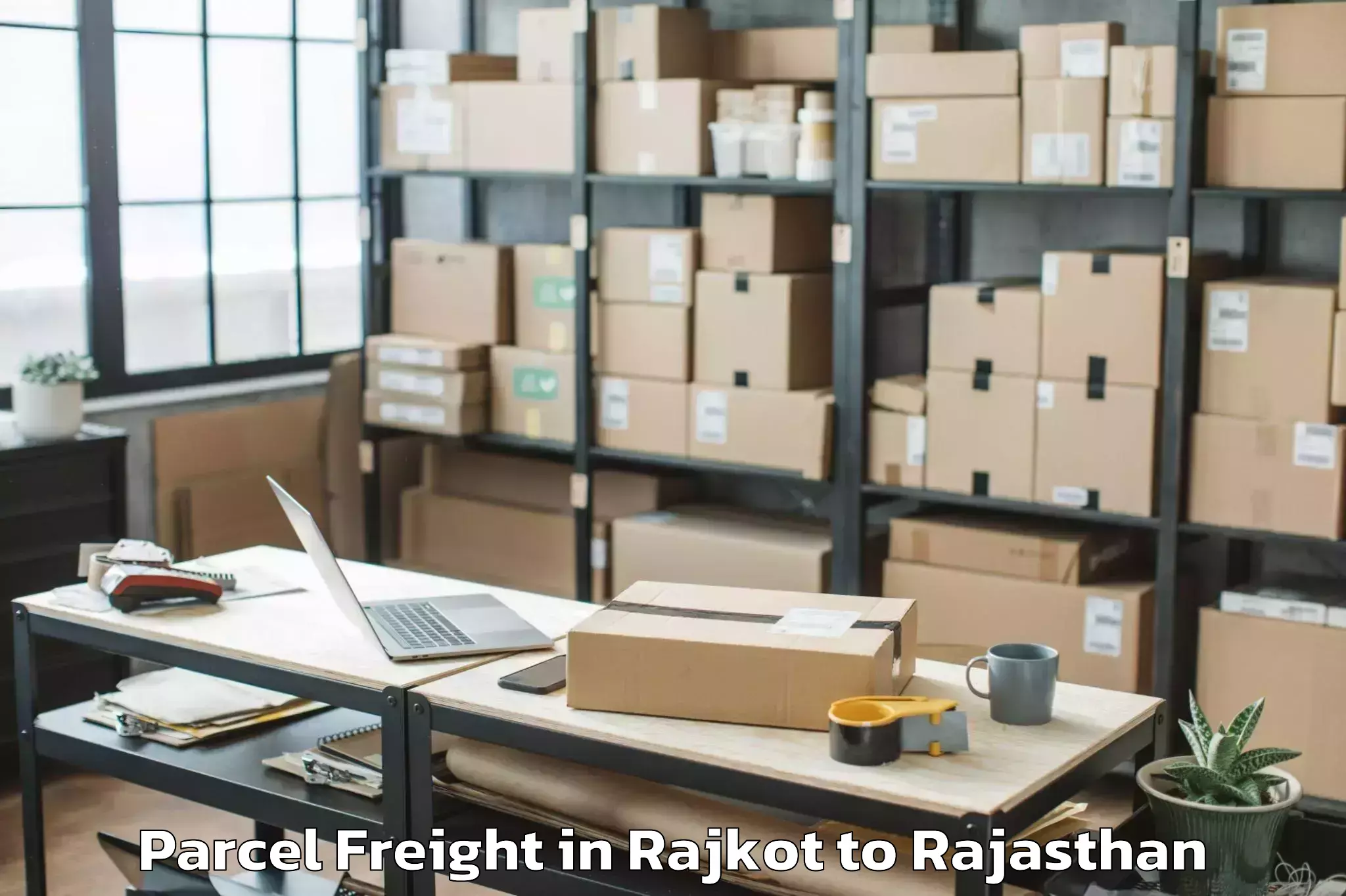 Book Rajkot to Kumher Parcel Freight